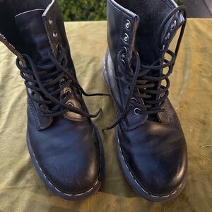 as Dr. Martens 1460 W combat boots.